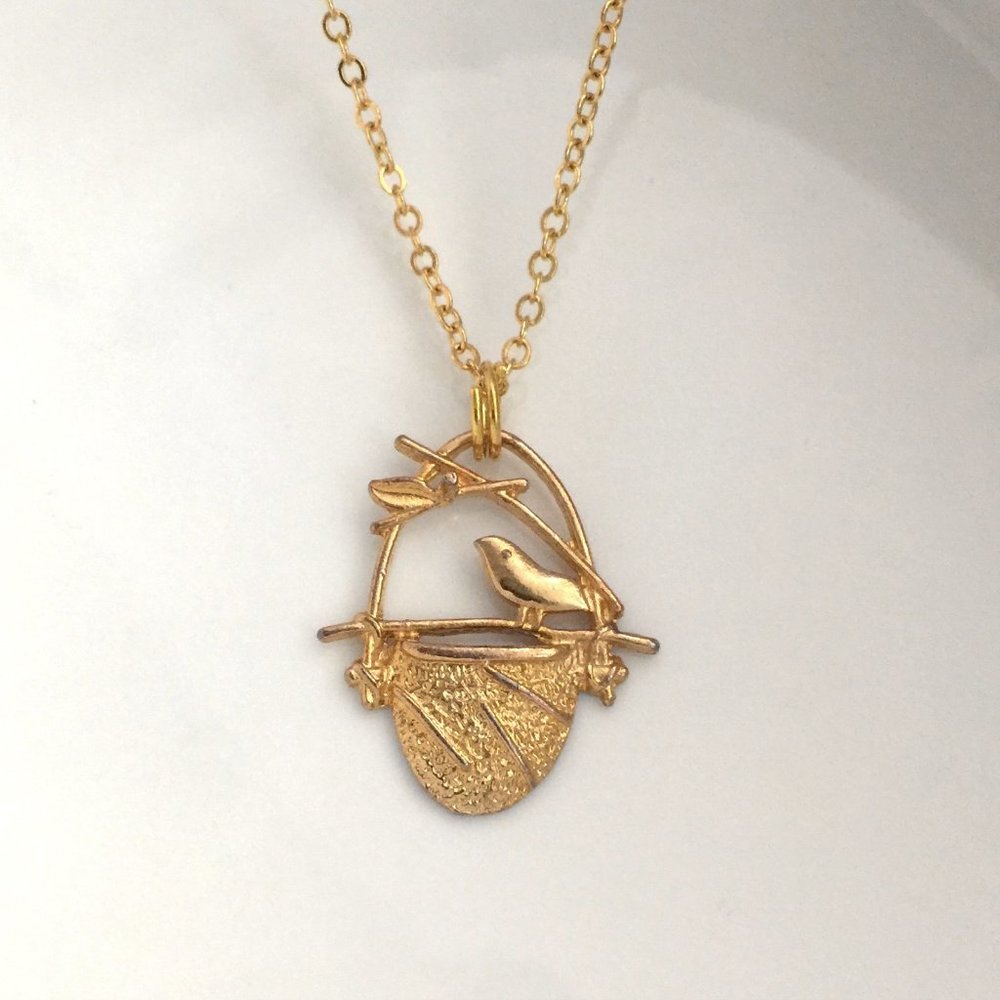 Miniature Gold Tone Bird Perched on a birdcage Bird nest Charm Necklace